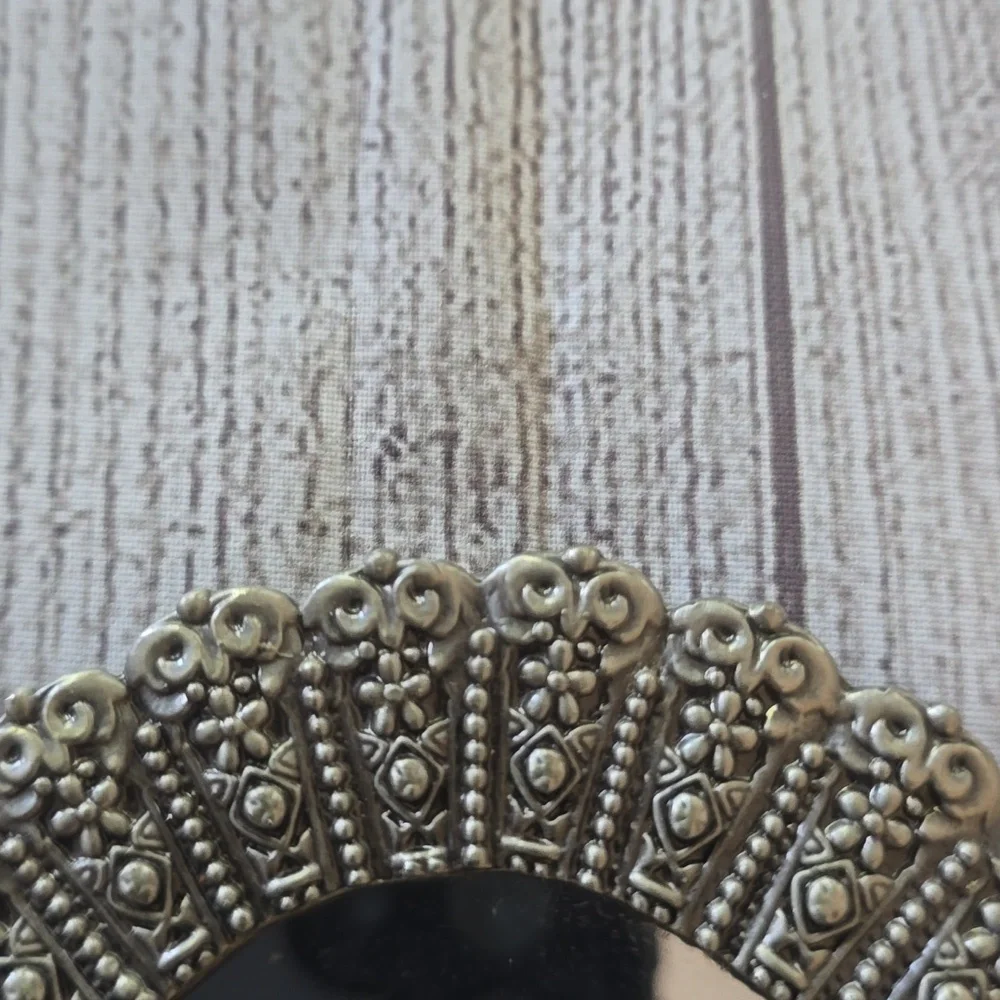 Set of 2 new silver, oval shaped ornate mirror sconces.